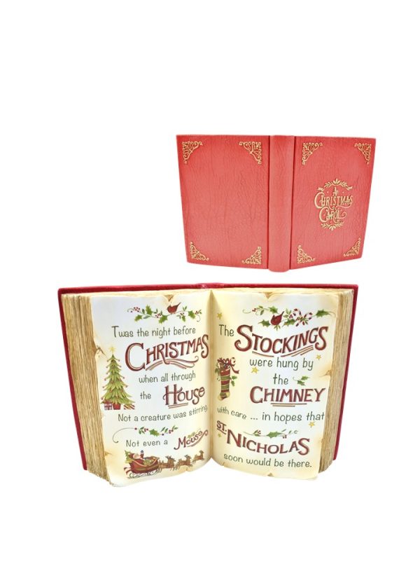 A Christmas-themed book-shaped keepsake box shown closed in red with gold corner details, and open to reveal cream-colored pages with vintage-style Christmas text and illustrations.