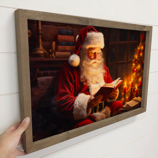 Santa Reading by Candlelight Framed Canvas Art